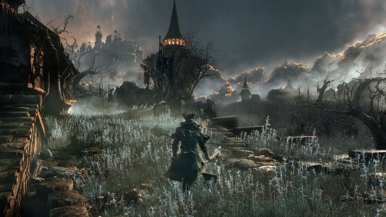 Official screenshot: a hunter crossing ruins in a grassy field with a tall tower on the horizon.