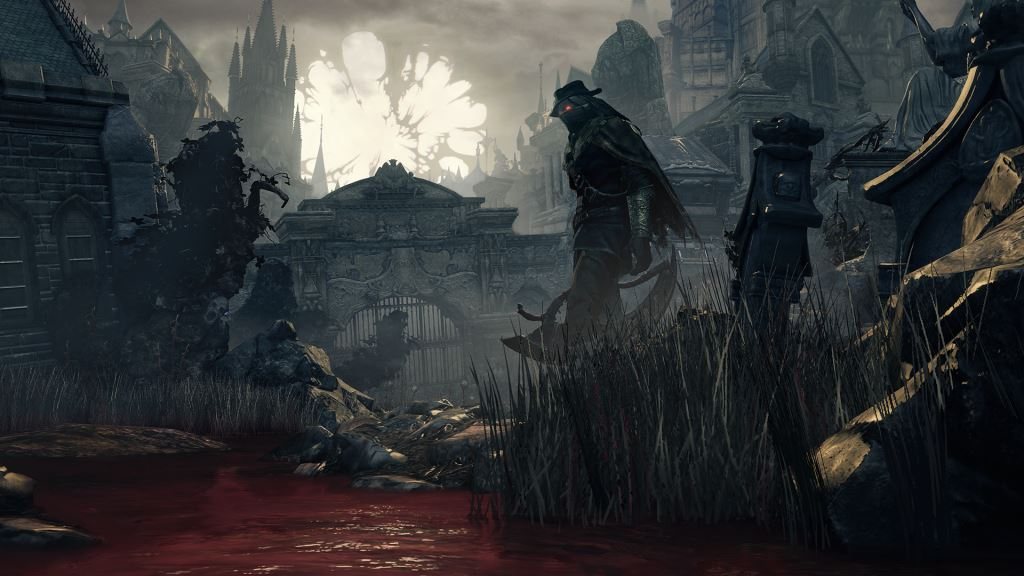 Official screenshot: a large pale many-limbed beast looming over a fallen figure in a dark cave.