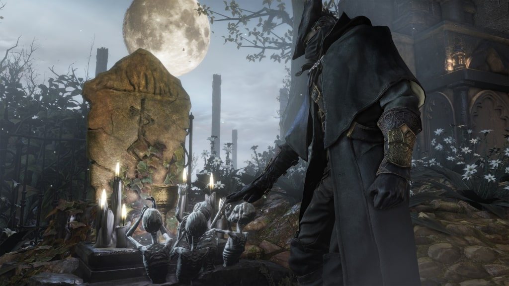 Official screenshot: a hunter standing in a graveyard under a pale moon beside headstones.